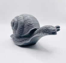 Load image into Gallery viewer, Handmade vegan soaps featuring a detailed snail, in beautiful eco friendly packaging. crafted with natural French clays, activated charcoal and essential oils. a eco-friendly, zero waste gift that’s cruelty-free, skin-nourishing, the perfect gift for snail lovers, gardeners or for animal lovers. small business UK