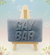 Load image into Gallery viewer, Handmade vegan soaps featuring the wording GAY BAR novelty gift. crafted with natural French clays, activated charcoal and essential oils. a eco-friendly, zero waste gift that’s cruelty-free, skin-nourishing, and perfect for pride gifts and LGBTQ gifts, hen party favours. wrapped in beautiful eco friendly packaging.