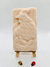 Load image into Gallery viewer, Handmade vegan soaps featuring a chicken sat on her nest of eggs, in beautiful eco friendly packaging. crafted with natural French clays, activated charcoal and essential oils. a eco-friendly, zero waste gift that’s cruelty-free, skin-nourishing, the perfect gift for easter and animal lovers. small business UK