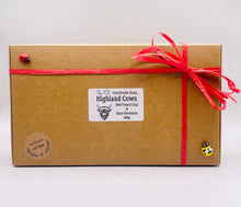 Load image into Gallery viewer, Handmade vegan soaps featuring a set of two chunky highland cow soaps, gift boxed .. crafted with natural French clays, activated charcoal and essential oils. a eco-friendly, zero waste gift that’s cruelty-free, skin-nourishing, and perfect for animal lover gifts and highland cow gifts for her. UK Small Business.