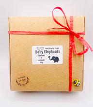 Load image into Gallery viewer, Handmade vegan soaps featuring a set of two baby elephants, gift boxed in beautiful eco friendly packaging. crafted with natural French clays, activated charcoal and essential oils. a eco-friendly, zero waste gift that’s cruelty-free, skin-nourishing, the perfect gift for elephant lovers or for animal lovers. small business UK