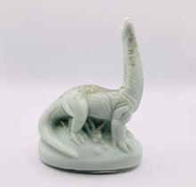 Load image into Gallery viewer, Handmade vegan Brontosaurus dinosaur shaped vegan soaps. crafted with natural French clays, activated charcoal and essential oils. a eco-friendly, zero waste gift that’s cruelty-free, skin-nourishing, and perfect for dragon dinosaur lovers and gifting.