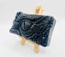 Load image into Gallery viewer, dragon Gift | dragon eye gift, dino gift, alternative gift, Dragon / Dinosaur Eye Vegan Soap Wooden display easels are available to purchase on a separate listing Calling all fantasy lovers! Step into a realm of mystical charm with our captivating dragon / dinosaur eye soap. This soap is vegan, cruelty free and available in your choice of colour and essential oil. All our soaps are made with natural clays and essential oils to gently cleanse and nourish your skin. eco conscious gift