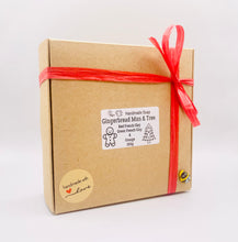Load image into Gallery viewer, Handmade vegan soaps shaped as a gingerbread man and a Christmas’s tree, gift boxed. crafted with natural French clays, activated charcoal and essential oils. a eco-friendly, zero waste gift that’s cruelty-free, skin-nourishing, and perfect for secret Santa and Christmas gifting . small business UK