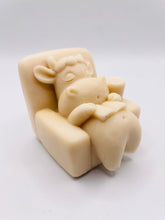 Load image into Gallery viewer, Handmade vegan cow sleeping on the sofa with book and coffee, shaped vegan soaps. crafted with natural French clays, activated charcoal and essential oils. a eco-friendly, zero waste gift that’s cruelty-free, skin-nourishing, and perfect for animal lovers and gifting. small business UK