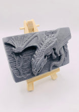 Load image into Gallery viewer, Our Flying Dragon soap features a striking dragon with its majestic wings spread wide, symbolising freedom and power. This artisan bar is vegan, cruelty-free, and designed with care for both your skin and the planet. Available in your choice of colour and essential oil. Each soap comes beautifully wrapped in eco