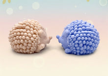 Load image into Gallery viewer, Handmade vegan soaps featuring a cute waving hedgehog, packaged in beautiful eco friendly packaging. crafted with natural French clays, activated charcoal and essential oils. a eco-friendly, zero waste gift that’s cruelty-free, skin-nourishing, the perfect gift for hedgehog lovers and animal lovers. small business UK