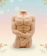 Load image into Gallery viewer, A highly detailed handmade vegan soap in the shape of a muscular male torso, featuring a detailed sculptural design, displayed against a whimsical background for a sophisticated farmhouse decor touch.