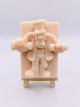 Load image into Gallery viewer, Handmade vegan soap featuring a Frankenstein monster with his arms reaching out and packaged in beautiful eco friendly packaging. crafted with natural French clays, activated charcoal and essential oils. a eco-friendly, zero waste gift that’s cruelty-free, skin-nourishing, and perfect for horror lovers and halloween themed gifts. Small business UK