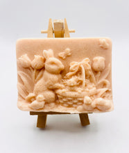 Load image into Gallery viewer, Handmade vegan soaps featuring the easter bunny with a basket full of chicks. , in beautiful eco friendly packaging. crafted with natural French clays, activated charcoal and essential oils. a eco-friendly, zero waste gift that’s cruelty-free, skin-nourishing, the perfect gift for easter and animal lovers. small business UK