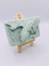 Load image into Gallery viewer, Dragon gift. Dinosaur gift. Our Flying Dragon soap features a striking dragon with its majestic wings spread wide, symbolising freedom and power. This artisan bar is vegan, cruelty-free, and designed with care for both your skin and the planet. Available in your choice of colour and essential oil. Each soap comes beautifully wrapped in eco friendly packaging. zero waste gift. kodern gift ideas. handmade home style. eco conscious home. eco friendly gifts. go green home.