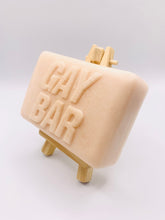 Load image into Gallery viewer, Handmade vegan soap featuring the writing GAY BAR and packaged in beautiful eco friendly packaging. crafted with natural French clays, activated charcoal and essential oils. a eco-friendly, zero waste gift that’s cruelty-free, skin-nourishing, and perfect for pride Gifts and novelty themed gifts. Small business UK