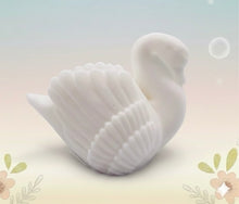 Load image into Gallery viewer, Handmade vegan soaps featuring a graceful swan and packed in beautiful eco friendly packaging crafted with natural French clays, activated charcoal and essential oils. a eco-friendly, zero waste gift that’s cruelty-free, skin-nourishing, and perfect for swan lovers, wedding favours and animal themed gifts. small business UK