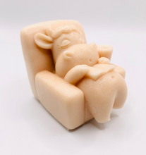 Load image into Gallery viewer, Handmade vegan cow sleeping on the sofa with book and coffee, shaped vegan soaps. crafted with natural French clays, activated charcoal and essential oils. a eco-friendly, zero waste gift that’s cruelty-free, skin-nourishing, and perfect for animal lovers and gifting. small business UK