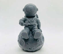 Load image into Gallery viewer, Space Gift | Astronaut Gift | NASA Gift | Astronomy| Astronaut & Moon Vegan Soap Experience out-of-this-world cleanliness with this astronaut casually sitting on the moon! Available in your choice of colour and essential oil. Eco conscious gift. Vegan and cruelty free. All soaps are made with natural clays and essential oils to gently cleanse and nourish your skin. eco-friendly packaging. zero waste gifts. modern gift ideas. handmade home style. eco conscious home. green living.