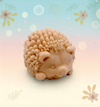 Load image into Gallery viewer, Handmade vegan soaps featuring a cute waving hedgehog, packaged in beautiful eco friendly packaging. crafted with natural French clays, activated charcoal and essential oils. a eco-friendly, zero waste gift that’s cruelty-free, skin-nourishing, the perfect gift for hedgehog lovers and animal lovers. small business UK