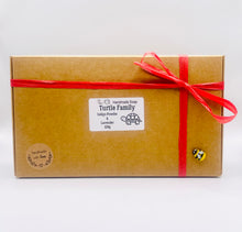 Load image into Gallery viewer, Handmade vegan soaps featuring a set of 5 turtle family soaps and gift boxed in beautiful eco friendly packaging crafted with natural French clays, activated charcoal and essential oils. a eco-friendly, zero waste gift that’s cruelty-free, skin-nourishing, and perfect for turtle lovers and animal themed gifts. small business UK