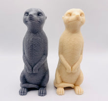 Load image into Gallery viewer, Handmade vegan soaps featuring a cheeky meerkat standing on his back legs. packaged in beautiful eco friendly packaging crafted with natural French clays, activated charcoal and essential oils. a eco-friendly, zero waste gift that’s cruelty-free, skin-nourishing, and perfect for meerkat lovers and animal themed gifts. small business UK