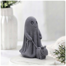 Load image into Gallery viewer, Decorative vegan soap figure of a ghost with a dog on a leash in a bright room with flowers.