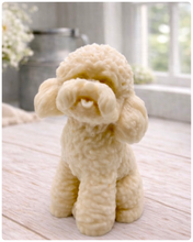 Load image into Gallery viewer, handmade vegan soap in the shape of a realistic sitting cockapoo or poodle sculpture, featuring detailed curly fur texture and a classic poodle groom, displayed on a rustic white wooden surface in a bright farmhouse decor setting.