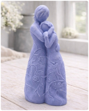 Load image into Gallery viewer, handmade vegan soap, sculpted as a mother and daughter in a tender standing embrace, featuring an intricate embossed floral and vine pattern on their dresses.