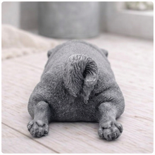 Load image into Gallery viewer, A detailed handmade vegan soap gift, sculpted in the shape of a pug dog lying flat on its stomach in a sleeping position, showing realistic skin folds and fur texture