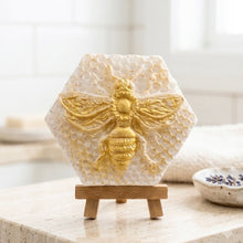 Load image into Gallery viewer, handmade vegan soap gift featuring a detailed honey bee in shimmering gold, displayed on a wooden easel
