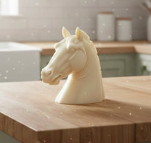 Load image into Gallery viewer, A beautiful handmade vegan soap in the shape of a realistic horse head sculpture, featuring detailed muscular definition and a flowing mane, set against a whimsical farmhouse decor background