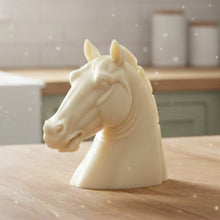 Load image into Gallery viewer, A beautiful handmade vegan soap in the shape of a realistic horse head sculpture, featuring detailed muscular definition and a flowing mane, set against a whimsical farmhouse decor background