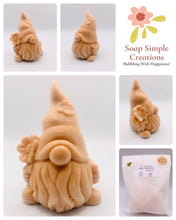 Load image into Gallery viewer, Handmade vegan soaps featuring a chunky gnome with a flower on his hat and a flower in his hand . gift boxed in beautiful eco friendly packaging. crafted with natural French clays, activated charcoal and essential oils. a eco-friendly, zero waste gift that’s cruelty-free, skin-nourishing, the perfect gift for gnome lovers and nature lovers. UK Small Business