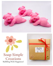 Load image into Gallery viewer, Handmade vegan soaps featuring a set of three cute laughing pigs, gift boxed in beautiful eco friendly packaging. crafted with natural French clays, activated charcoal and essential oils. a eco-friendly, zero waste gift thatās cruelty-free, skin-nourishing, and perfect for animal lovers, pig lovers and teacher appreciation gifts. small business UK