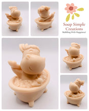 Load image into Gallery viewer, Handmade vegan soap featuring a cow in the bath scrubbing his back and packed in beautiful eco friendly packaging. crafted with natural French clays, activated charcoal and essential oils. a eco-friendly, zero waste gift that’s cruelty-free, skin-nourishing, and perfect for cow lovers or animal themed gifts. Small business UK