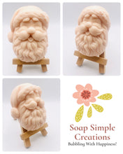 Load image into Gallery viewer, Handmade vegan traditional Santa Claus face shaped vegan soaps. crafted with natural French clays, activated charcoal and essential oils. a eco-friendly, zero waste gift that’s cruelty-free, skin-nourishing, and perfect for Christmas gifts, secret Santa and stocking fillers. Small business UK
