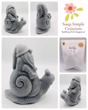 Load image into Gallery viewer, Handmade vegan soaps featuring a detailed snail with a gnome catching a ride on his back soap. crafted with natural French clays, activated charcoal and essential oils. a eco-friendly, zero waste gift that’s cruelty-free, skin-nourishing, and perfect for turtle lovers and gnome lover gifts. small business UK
