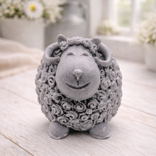 Load image into Gallery viewer, A highly detailed handmade vegan soap sculpted in the shape of a sturdy ram with a thick coat of tight, curly wool and large, elegant curved horns, displayed on a light wooden surface in a bright farmhouse setting.