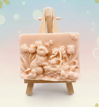 Load image into Gallery viewer, Handmade vegan soaps featuring the easter bunny with a basket full of chicks. , in beautiful eco friendly packaging. crafted with natural French clays, activated charcoal and essential oils. a eco-friendly, zero waste gift that’s cruelty-free, skin-nourishing, the perfect gift for easter and animal lovers. small business UK