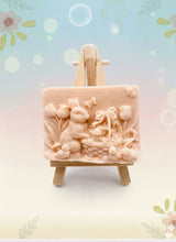Load image into Gallery viewer, Handmade vegan soaps featuring the easter bunny with a basket full of chicks. , in beautiful eco friendly packaging. crafted with natural French clays, activated charcoal and essential oils. a eco-friendly, zero waste gift that’s cruelty-free, skin-nourishing, the perfect gift for easter and animal lovers. small business UK