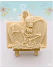 Load image into Gallery viewer, Handmade vegan soaps featuring a skeleton dancing on his RIP grave. crafted with natural French clays, activated charcoal and essential oils. a eco-friendly, zero waste gift that’s cruelty-free, skin-nourishing, and perfect for skull lovers and Halloween gifting . Small business UK