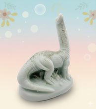 Load image into Gallery viewer, Handmade vegan Brontosaurus dinosaur shaped vegan soaps. crafted with natural French clays, activated charcoal and essential oils. a eco-friendly, zero waste gift that’s cruelty-free, skin-nourishing, and perfect for dragon dinosaur lovers and gifting.