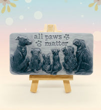 Load image into Gallery viewer, dog lover gift. cat lover gift. animal lover gift. zero waste gift. modern gifts. handmade home style. This beautifully detailed, chunky bar features a line-up of our loyal four-legged friends, reminding us of the love, joy, and muddy footprints they bring into our lives. The one in the photo is made with charcoal and lavender essential oil, soothing, earthy, and perfect for washing the day away (or after a long dog walk!). eco conscious home. eco conscious living.