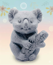 Load image into Gallery viewer, Handmade vegan soaps featuring a chunky koala bear climbing a tree packaged in beautiful eco friendly packaging crafted with natural French clays, activated charcoal and essential oils. a eco-friendly, zero waste gift that’s cruelty-free, skin-nourishing, and perfect for koala bear lovers and animal themed gifts. small business UK