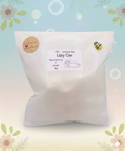 Load image into Gallery viewer, Handmade vegan cow sleeping on the sofa with book and coffee, shaped vegan soaps gift boxed. crafted with natural French clays, activated charcoal and essential oils. a eco-friendly, zero waste gift that’s cruelty-free, skin-nourishing, and perfect for animal lovers and gifting. small business UK