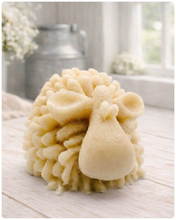 Load image into Gallery viewer, A highly detailed handmade vegan soap sculpted in the shape of a fluffy sheep with thick, textured wool and a smooth face, displayed on a light wooden surface in a farmhouse-style setting.
