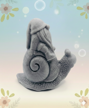 Load image into Gallery viewer, Handmade vegan soaps featuring a detailed snail with a gnome catching a ride on his back soap. crafted with natural French clays, activated charcoal and essential oils. a eco-friendly, zero waste gift that’s cruelty-free, skin-nourishing, and perfect for turtle lovers and gnome lover gifts. small business UK