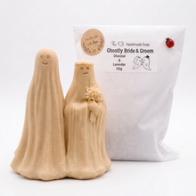 Load image into Gallery viewer, handmade vegan soap featuring a ghostly bride with a bouquet and a groom, a unique farmhouse decor wedding or anniversary gift