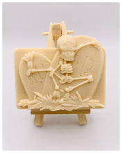 Load image into Gallery viewer, Handmade vegan soaps featuring a skeleton dancing on his RIP grave. crafted with natural French clays, activated charcoal and essential oils. a eco-friendly, zero waste gift that’s cruelty-free, skin-nourishing, and perfect for skull lovers and Halloween gifting . Small business UK