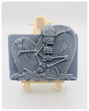 Load image into Gallery viewer, Handmade vegan soaps featuring a skeleton dancing on his RIP grave. crafted with natural French clays, activated charcoal and essential oils. a eco-friendly, zero waste gift that’s cruelty-free, skin-nourishing, and perfect for skull lovers and Halloween gifting . Small business UK
