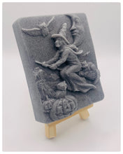 Load image into Gallery viewer, Handmade vegan soaps featuring a witch flying on her broomstick. crafted with natural French clays, activated charcoal and essential oils. a eco-friendly, zero waste gift thatās cruelty-free, skin-nourishing, and perfect for witch gifts and Halloween gifts. Small business UK