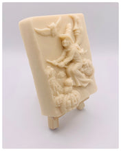 Load image into Gallery viewer, Handmade vegan soaps featuring a witch flying on her broomstick. crafted with natural French clays, activated charcoal and essential oils. a eco-friendly, zero waste gift thatās cruelty-free, skin-nourishing, and perfect for witch gifts and Halloween gifts. Small business UK