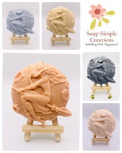 Load image into Gallery viewer, Handmade vegan soap featuring a witch flying on her broomstick and packaged in beautiful eco friendly packaging. crafted with natural French clays, activated charcoal and essential oils. a eco-friendly, zero waste gift that’s cruelty-free, skin-nourishing, and perfect for horror lovers and halloween themed gifts. Small business UK